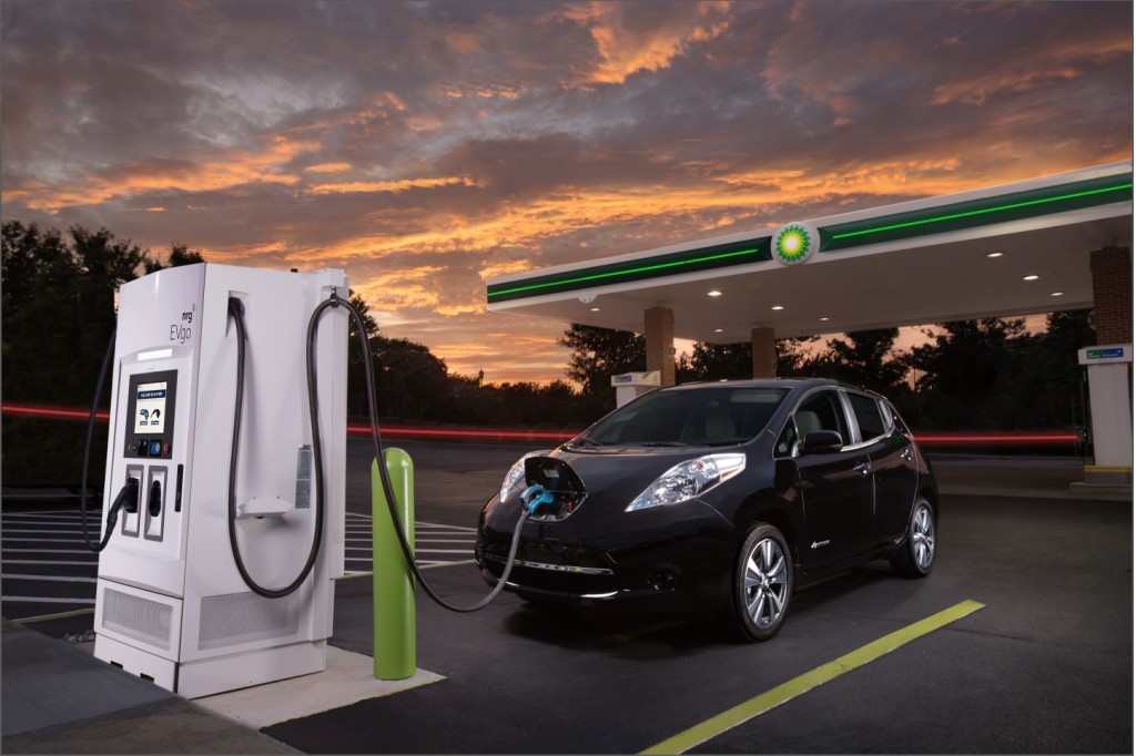 Image Nissan Leaf Electric Car Using DC Fast charging Station At BP In Image Nissan Leaf Electric Car Using DC Fast charging Station At BP In