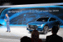 Audi of America president Scot Keogh with Audi e-tron quattro concept, 2015 Los Angeles auto show