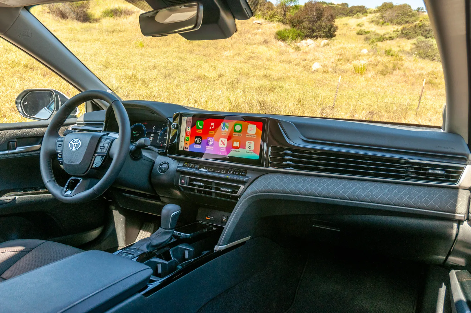 2025 Toyota Camry centre console with wireless charging pad and electronic gear selector