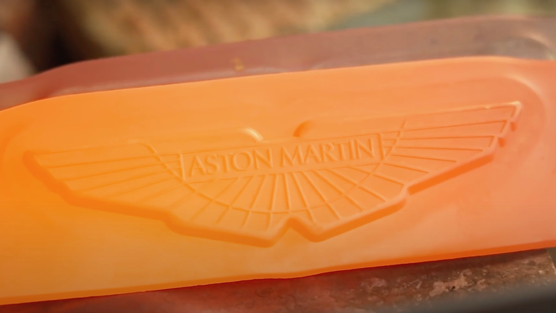 The Aston Martin badge is cast in hearth at 1,472 levels Auto Recent
