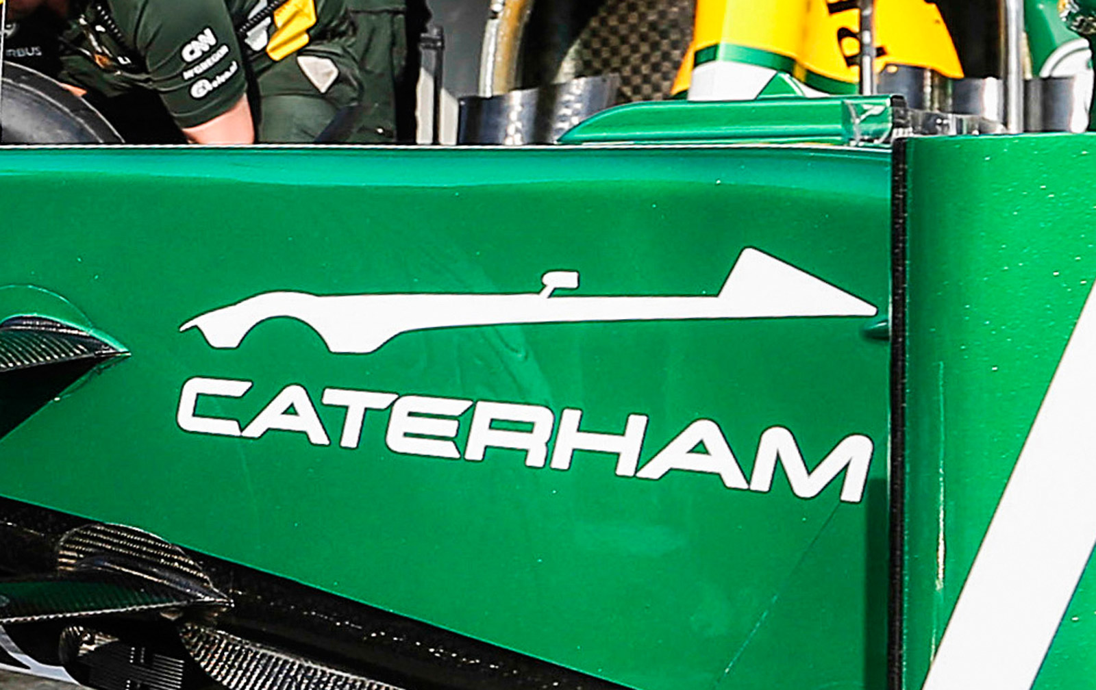 Caterham Racing Graphics Caterham Teases Silhouette Of New Sports Car On Its F1 Car