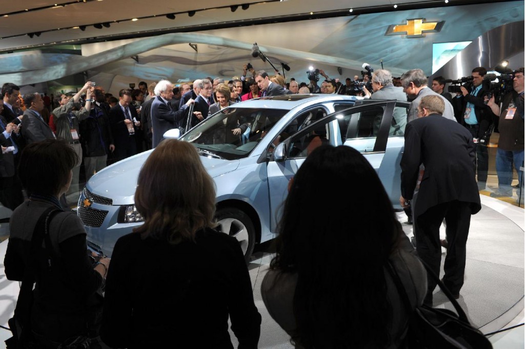 2010 Detroit Auto Show, with Speaker of the House Nancy Pelosi inspecting a 2011 Chevrolet Cruze