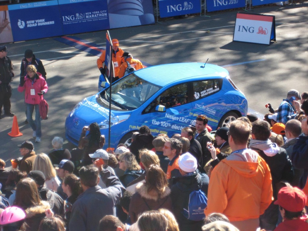 2011 Nissan Leaf electric car at NYC Marathon, Oct 2010, with Marathon CEO Mary Wittenberg