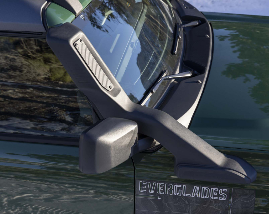 The backing plate on the Everglades' snorkel can be removed with three screws and moved to the rear (or front) of the snorkel depending on the wind, the actvity, and whether someone wants to hear more or less of the turbocharger huffing.