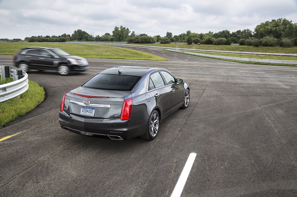 A 2015 Cadillac CTS, equipped with V2V technology, notifies the driver of the approaching Cadillac SRX from the left before the driver could see the vehicle. Cadillac Brings Semi-Autonomous Driving To GM Lineup In 2016