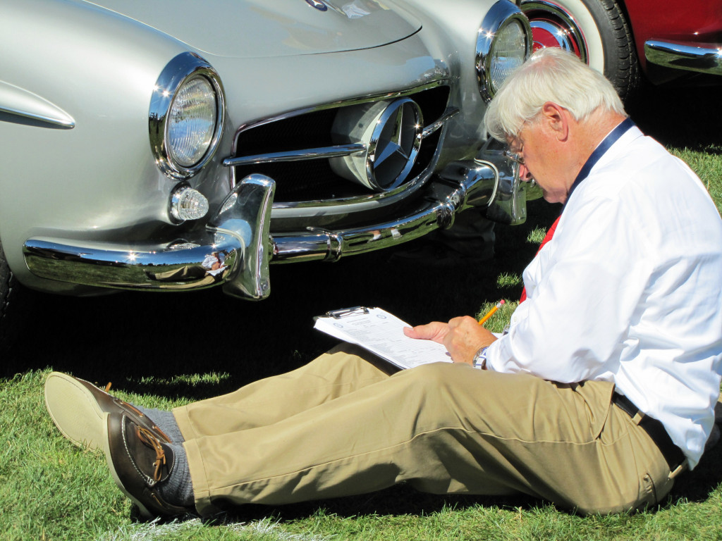 A concours Judge inspects a Mercedes-Benz 190SL | Bob Golfen photo