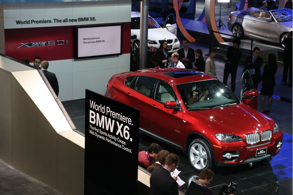 The new X6 attracts attention at the BMW stand during the North American International Auto Show What Happens At Auto Shows?