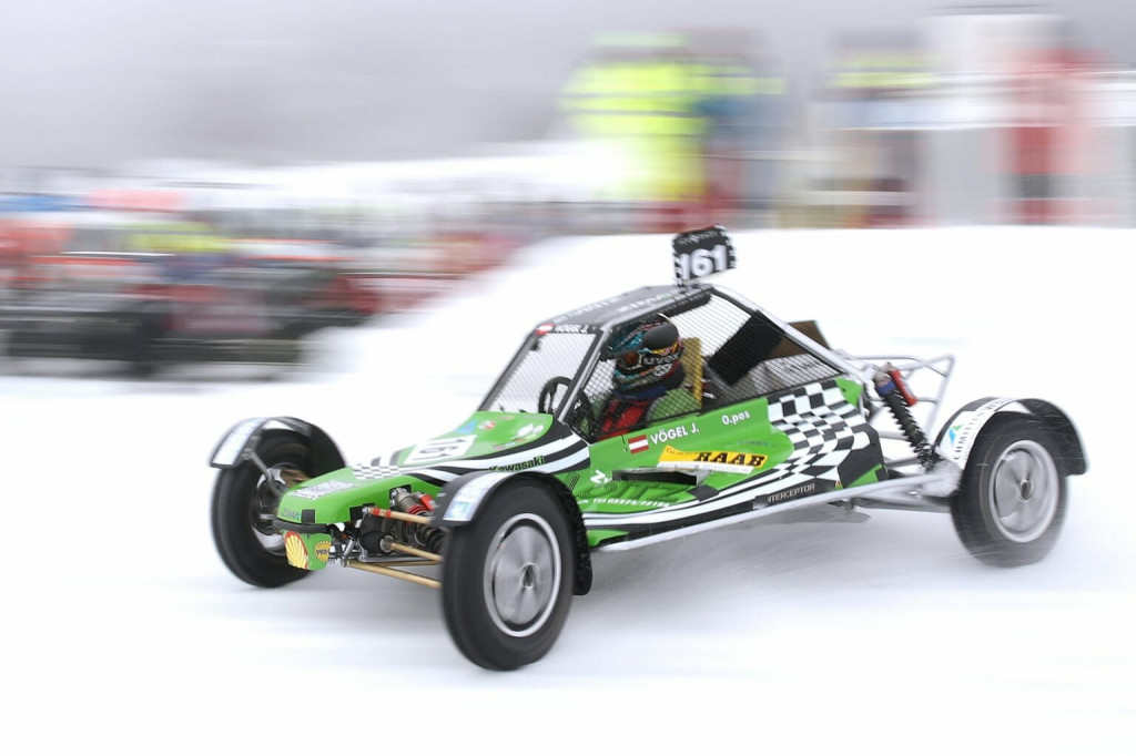 Buggy-style vehicle makes a run on the snow-covered track