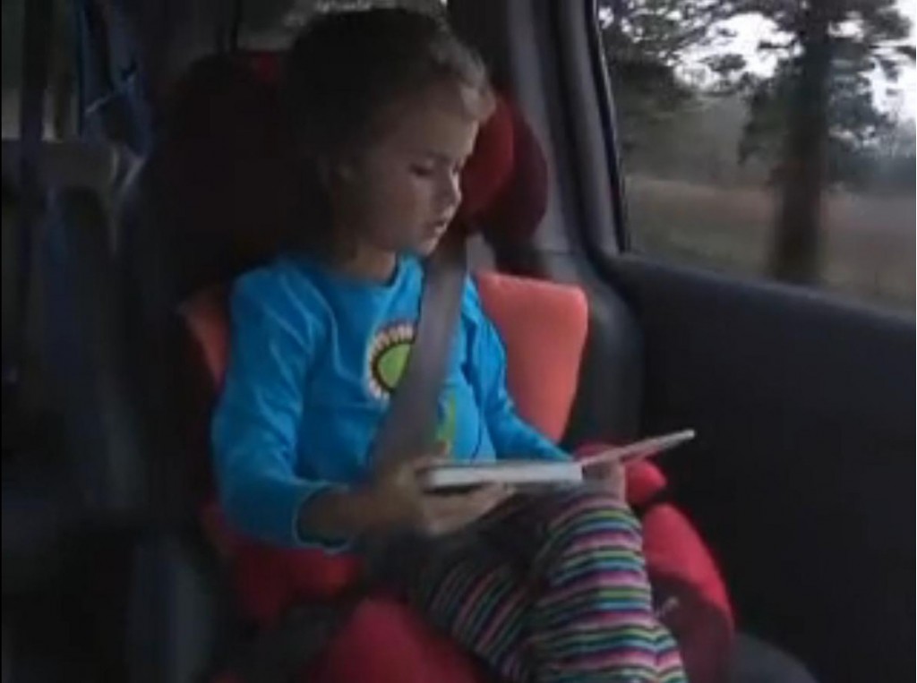 Child in booster seat -- from IIHS instructional video