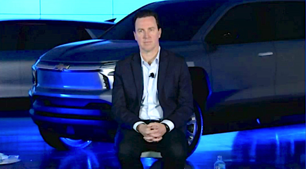 GM chief EV officer Travis Hester with Chevrolet electric truck