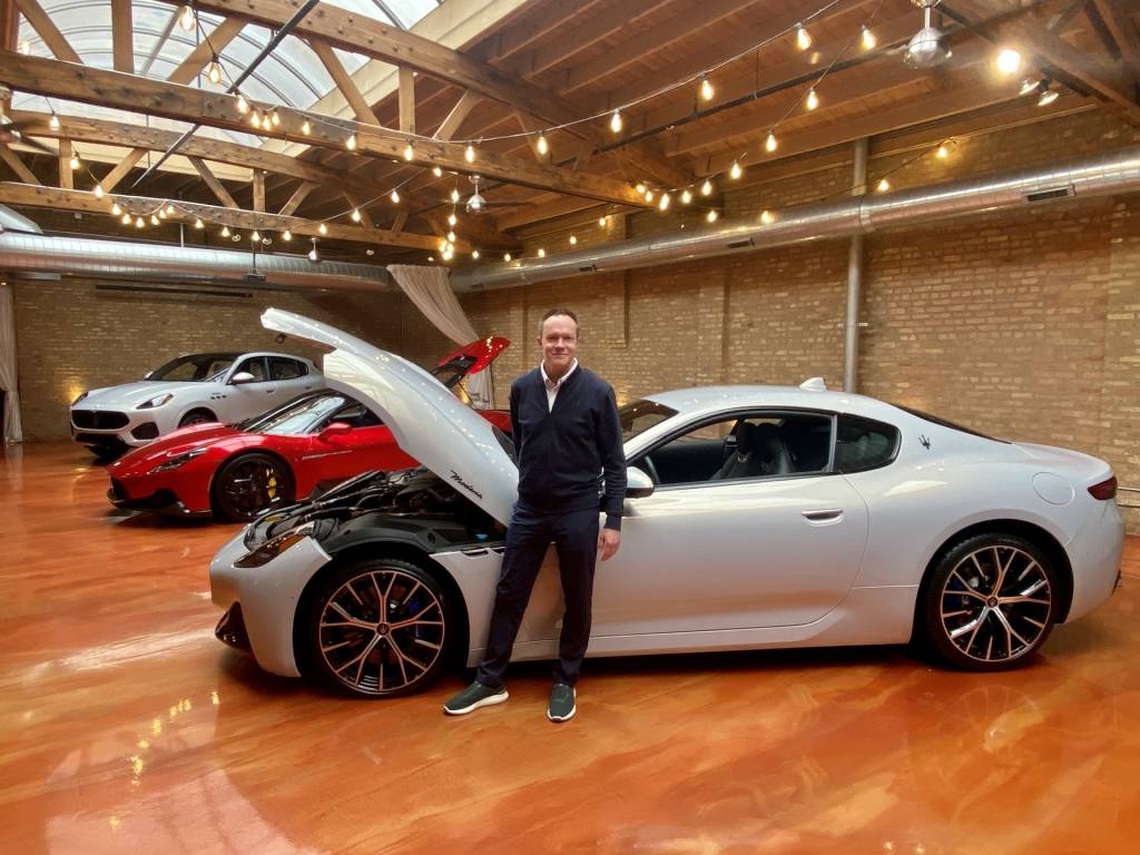 Bill Peffer, CEO of Maserati Americas, poses beside the 2024 Maserati GranTurismo