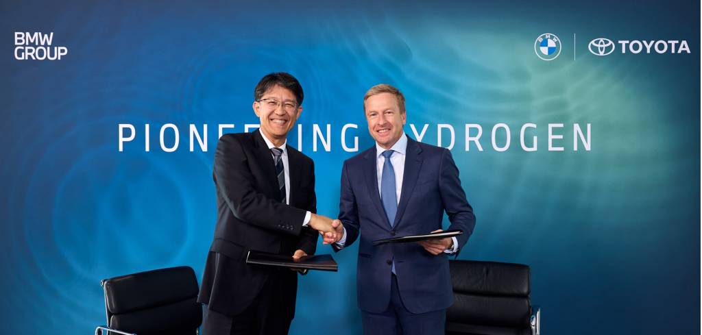 Toyota CEO Koji Sato (left) and BMW CEO Oliver Zipse