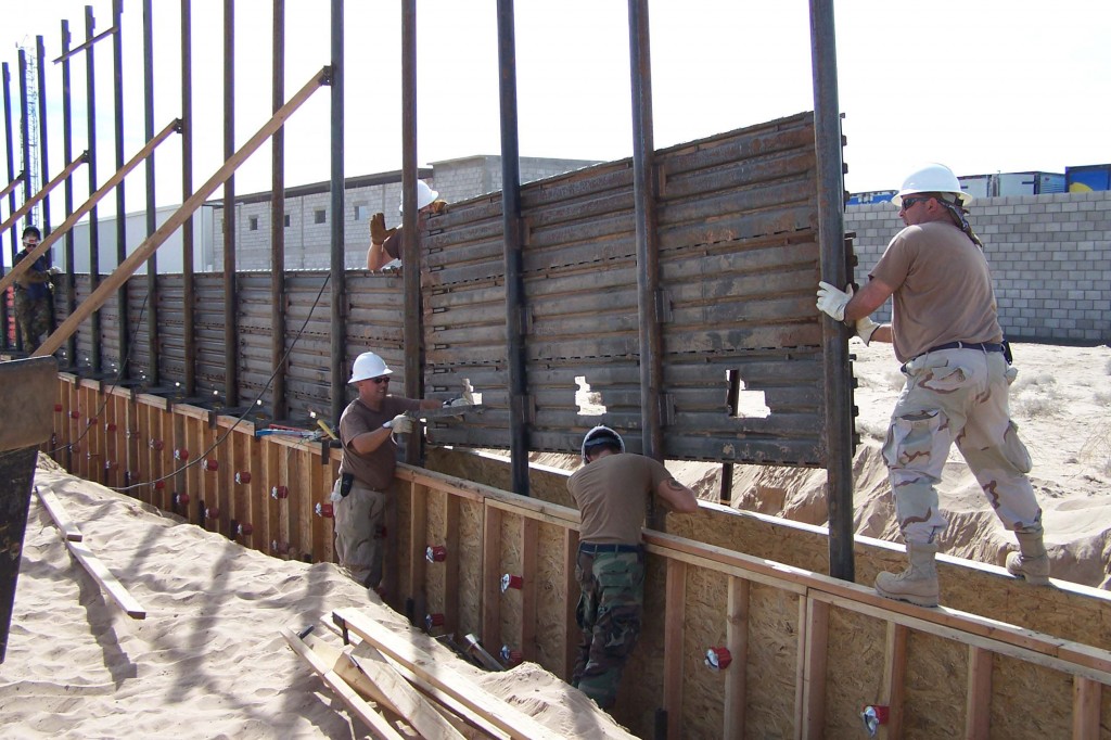 US Air Force airmen install a fence along the US-Mexico border east of San Luis, AZ