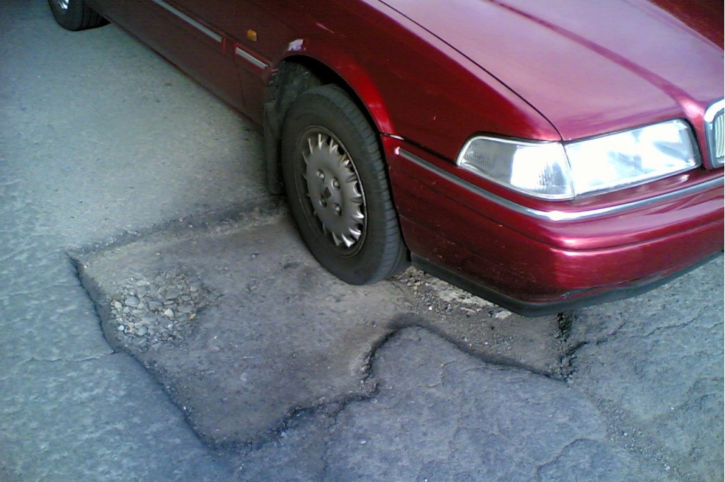 Volvo on pothole - flickr user comedy_nose
