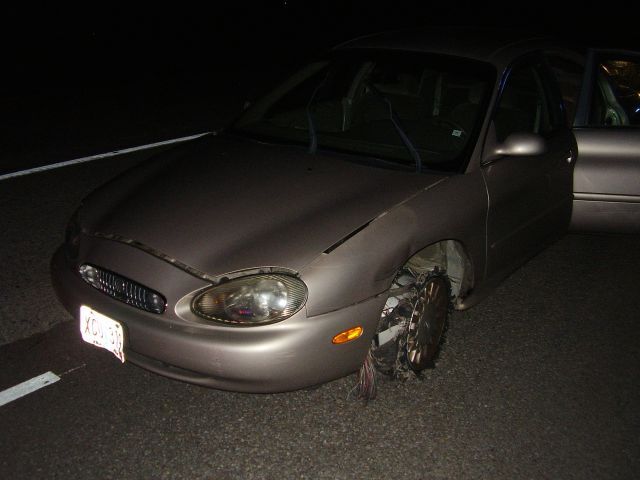 1998 Mercury Sable with blown tires from car chase