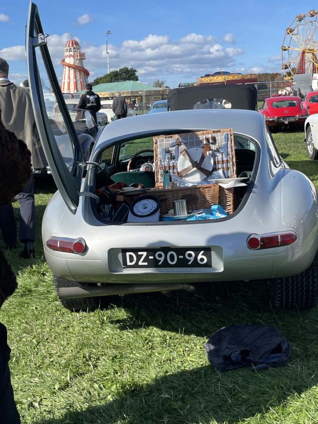 A picnic out of the back of a Jaguar E-Type in the 2022 Goodwood Revival parking lot