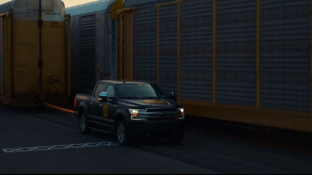 Ford F-150 electric prototype ready to pull train full of F-150s (From YouTube video)