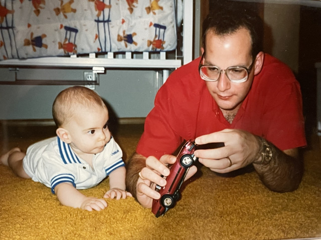 Joel and Dan Feder playing with a model Z car