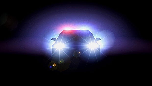 Police car with headlights on