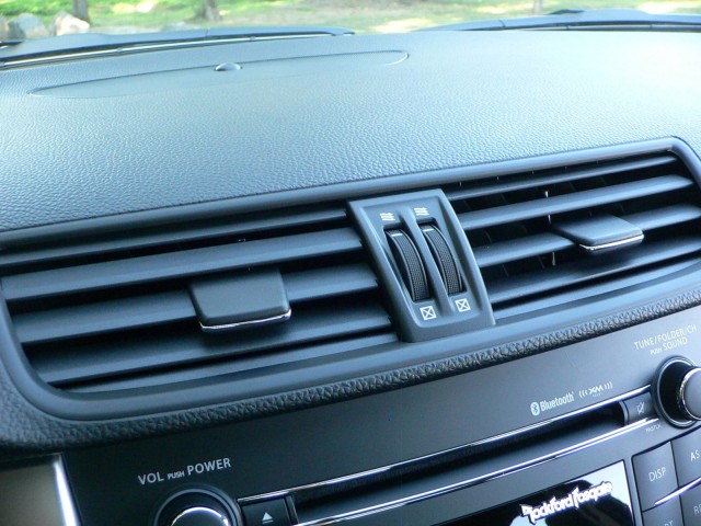 Nicely grained dash-top surface is slightly soft to the touch, and grippy dials control the vents. 