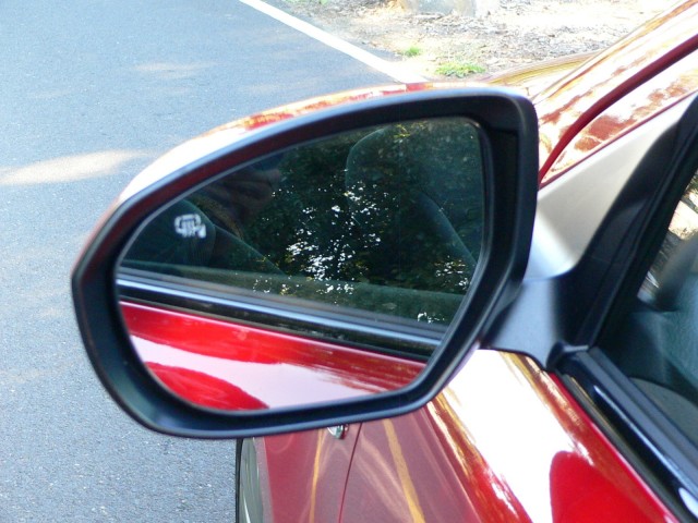 Large, sculpted mirrors were useful for visibility but a bit noisy in our pre-production test car.