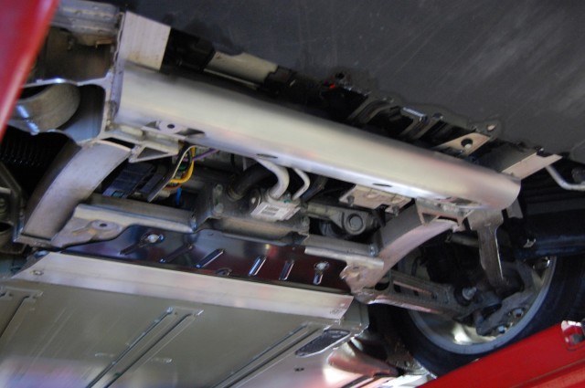 Tesla Model S added battery shield - half-tube, black titanium plate, T-section, from front to rear