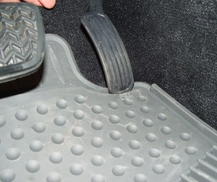 Loose all-weather floor mat jams accelerator pedal. Photo: NHTSA 
