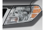 2010 Nissan Frontier 2WD Crew Cab SWB Auto SE Headlight
