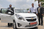 Chevrolet Beat EV electric vehicle with GM executives, India, June 2011