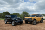 2021 Jeep Wrangler Sahara, black, and 2021 Ford Bronco Black Diamond, yellow 