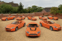Aston Martin orange collection (photo via Bonhams)