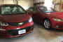 Charging 2017 Chevrolet Bolt EV and 2015 Tesla Model S P85D at home in garage  [photo: Jay Lucas]
