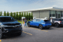 Chevrolet EVs at a Tesla Supercharger station