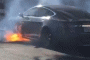 Director Michael Morris's Tesla Model S on fire [PHOTO CREDIT - MARY MCCORMICK]