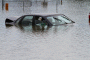 Flooded car in parking lot. Photo via Flickr user waitscm/CC2.0